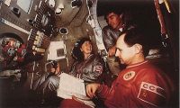 TM-12 crew in Soyuz trainer