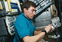 Sergei setting up biomedical samples in Spacehab